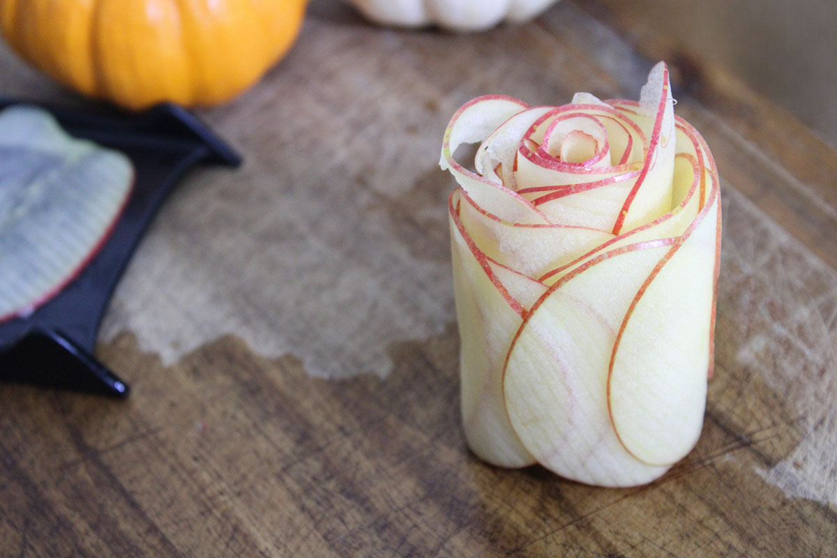 Apple slices rolled together to create a charcuterie rose.