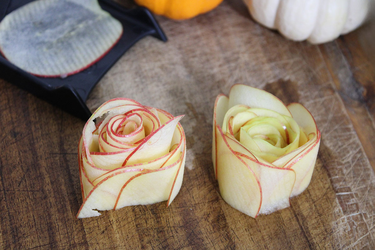 Thinly sliced apples arranged into two roses.